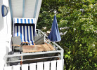 Fewo C**** - Balkon mit Sitzgruppe, Strandkorb und Kurparkblick