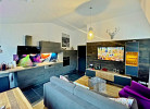 Fewo Bergzauber**** - Wohnzimmer mit Komfort-Küchenzeile