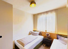 Schlafzimmer 2 mit TV - Villa Edelweiss*****